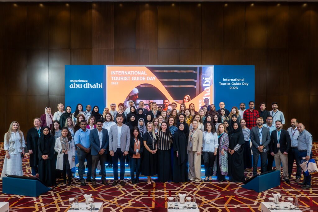 Emirati tourism team celebrating with DCT Abu Dhabi at International Tourist Guide Day 2026