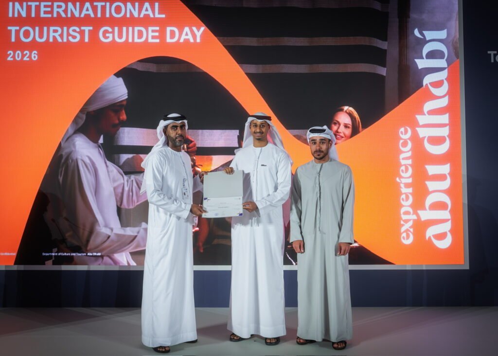 Tour By Emirati receiving award from DCT Abu Dhabi for authentic Emirati tourism at International Tourist Guide Day 2026